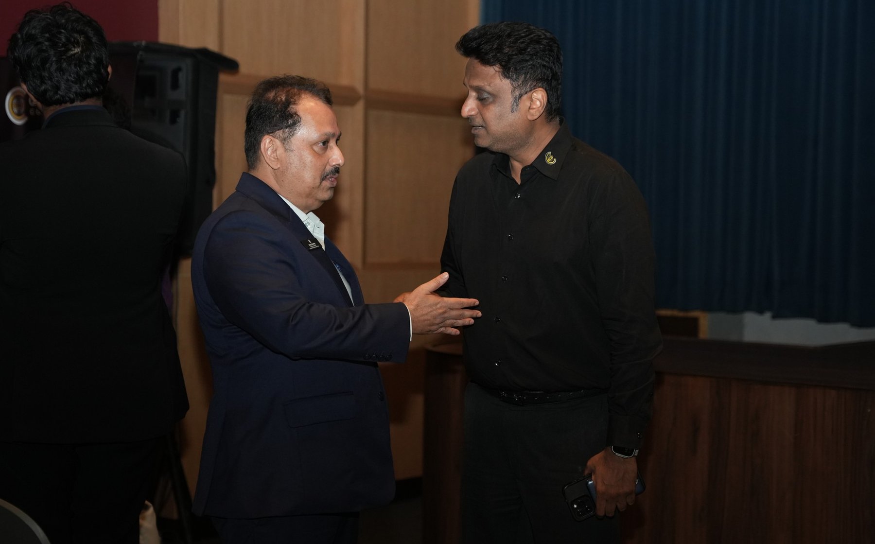 Uday Shetty greeting a guest at a Corporate Connections event