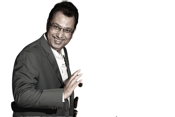 Uday Shetty gesturing warmly, as if welcoming someone in